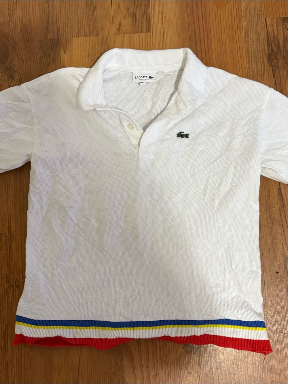 Lacoste Boys size 8 White Polo Shirt with Multicolor Hem, relaxed fit